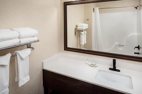Refresh at the spacious vanity with crisp towels nearby.