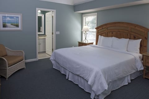 Unwind in a bright, serene bedroom with cozy linens.