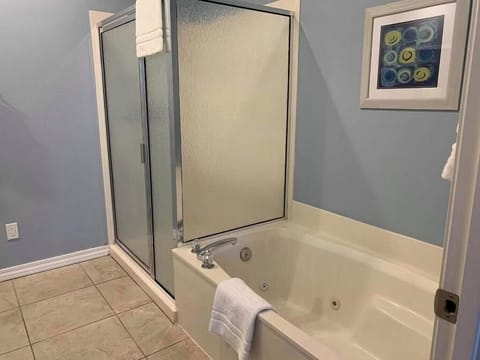 Recharge with a jetted tub soak and separate shower comfort.