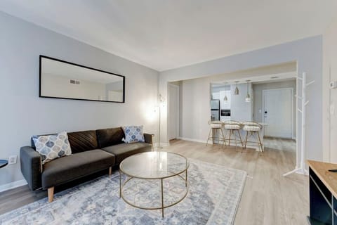 Bright open living area w/ comfy seating & plenty of natural light.