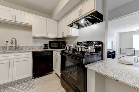 Spacious kitchen w/ ample counter space & bright cabinetry
