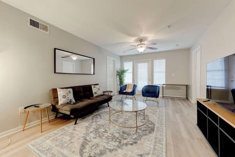 Bright open living area w/ comfy seating, TV, and seamless flow into the kitchen
