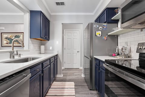 Galley style kitchen fully stocked with everything you need to feel at home.