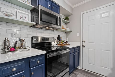 Galley style kitchen fully stocked with everything you need to feel at home.