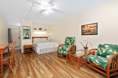 Relax in the studio's comfortable living area and king-sized bed — ideal for solo travelers or couples enjoying Kona.