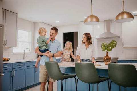 Our fully stocked kitchen features high-end appliances and a large island with high seating — perfect for cooking up feasts, sipping morning coffee, or sharing laughs while you prep meals.
