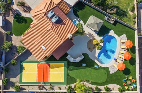 Your ultimate Peoria retreat awaits: private pool, sports court, outdoor games, plenty of poolside loungers, a fire pit, and endless memories to make!