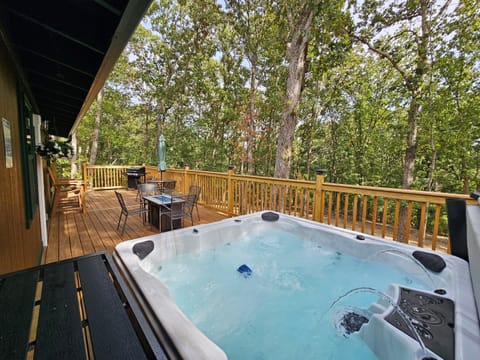 Enjoy dinner on the deck, fire up the grill, then slip into the hot tub — all with a peaceful forest view.