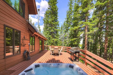 This large deck boasts a new hot tub and a gas grill 