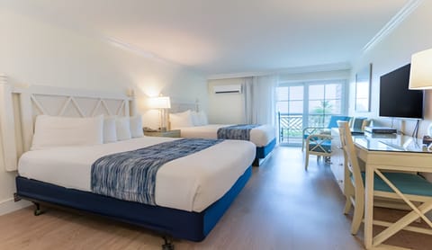 Stretch out on crisp beds in a sunlit, airy retreat.