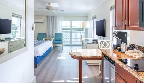 Ease into vacation with kitchenette comforts and bright bay views.