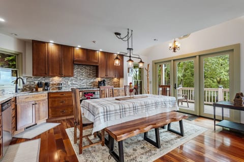 Chef kitchen with gas stove plus dining space for everyone to gather.