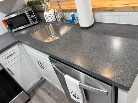 There is plenty of counter space and brand new stainless steel appliances. 