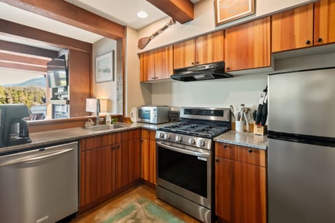 Modern appliances including a new Bosch dishwasher & LG True Convection Smart Range gas stove.