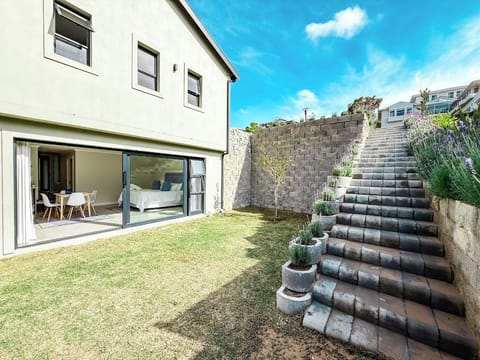 Steps down to unit from parking area.