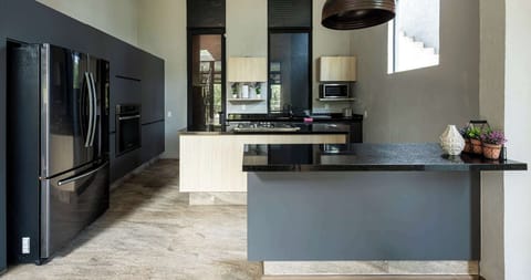 Fully equipped kitchen with full fridge, oven, microwave, stove, and dishwasher