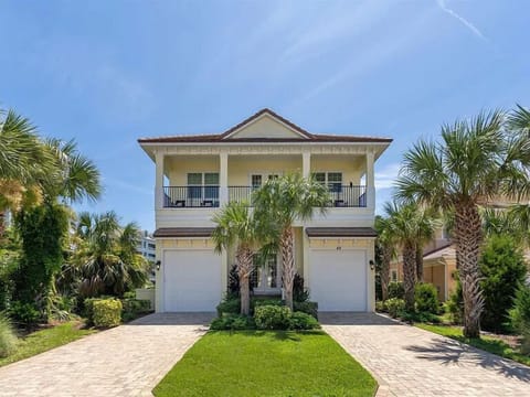 Welcome to your coastal getaway! Spacious two-story home with private driveway and garage, surrounded by lush palm trees