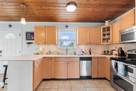 Fully equipped kitchen with stainless steel appliances and everything you need for home-cooked meals