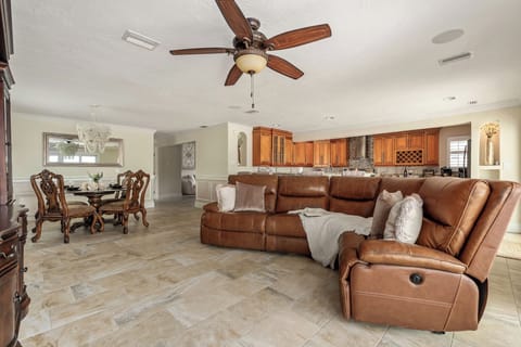 Living room: Gather in style with plush seating, a dining table, and an open flow to the kitchen.