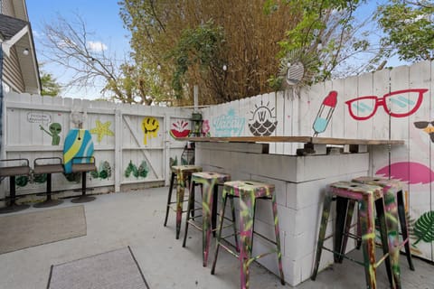 Private Patio with Bar leads to Back Yard. 