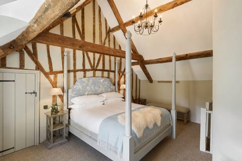 Dovecot blue bedroom with sheepskin rug