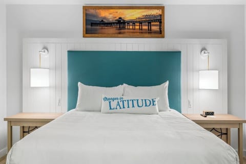 Drift off beneath warm lighting and hotel-crisp white linens.