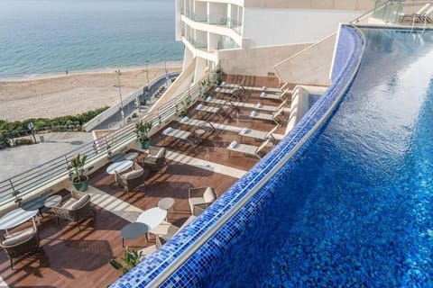Sip and lounge above the beach with breezy coastal vibes.
