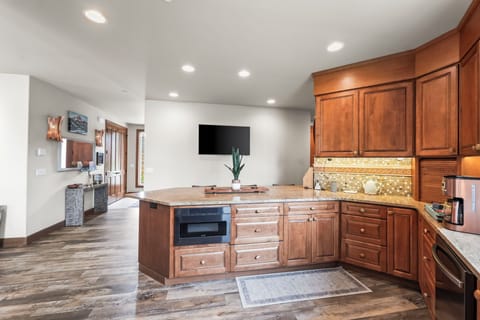 Microwave below, with a fully wheelchair-accessible kitchen.