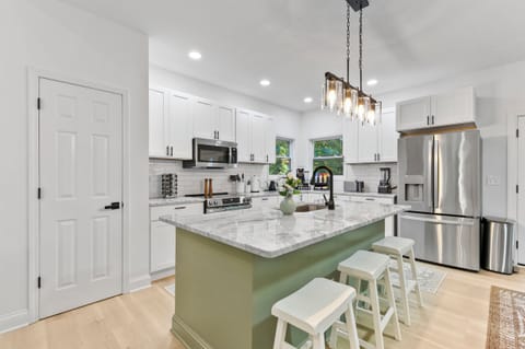Fully renovated kitchen with gorgeous countertops and stainless steel appliances