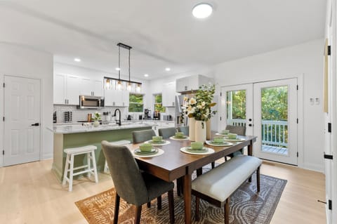 Open floor plan connects kitchen, dining, and living spaces
