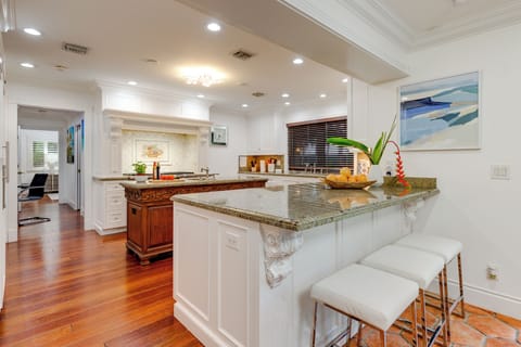 Barstool seating at the kitchen counter.