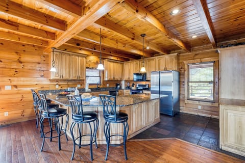 Additional barstool seating at the kitchen island.