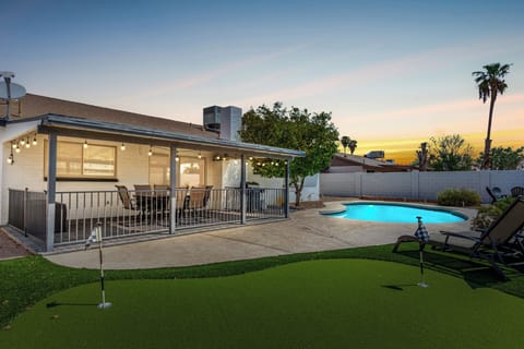 Relax and enjoy outdoor living with refreshing private pool and putting green. 