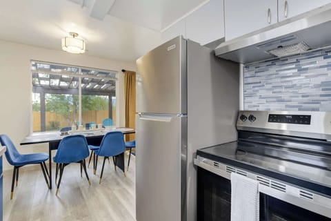 Open layout where the kitchen connects to the dining space, making group meals and conversations effortless.