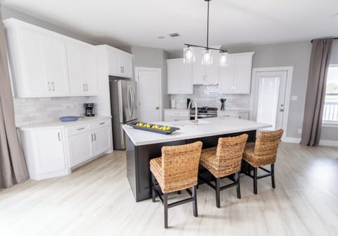 Fully equipped and ready for any meal, the kitchen features cookware, serving utensils, a coffee maker, blender, and all the essentials. Whether you’re preparing a quick snack or a family feast, this space makes cooking easy and enjoyable.