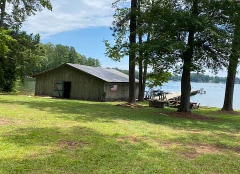 The original 1950's boathouse is equipped with canoe, kayak, and fishing rods for guests to enjoy