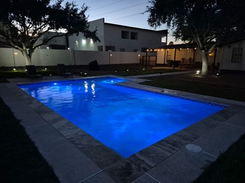 The Oak House pool and patio at night.