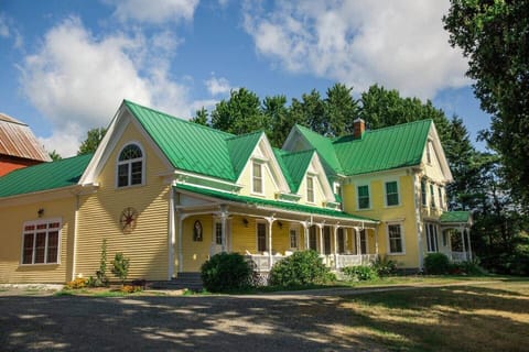 Exterior of the historic farmhouse. Built in the 1860's (but updated with modern amenities!) there's 6br, 3bath, and beds to fit 9-18 guests overnight.