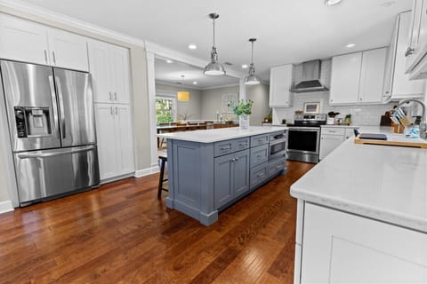 Beautiful kitchen with plenty of lighting and open floor plan to dining & living areas