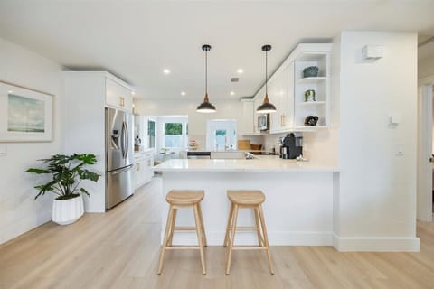 fully stocked chefs kitchen with coffee bar - designed for long term stays