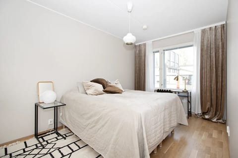 Apartment bedroom is bright and modern with hardwood floors. There is a 160cm wed where you can have calm sleep after your day at the city.