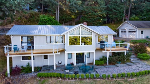 Two private decks with 180° water views, lounge seating, and a new gas BBQ.