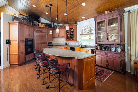Kitchen displays stained glass from original cottage