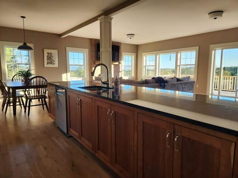 Kitchen island looking into dining and living rooms