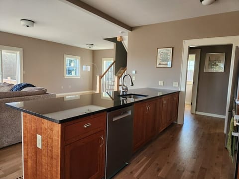 Kitchen island from dining room into kitchen and stairway