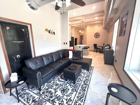 Stylish and comfortable living room, featuring an old bank safe door.