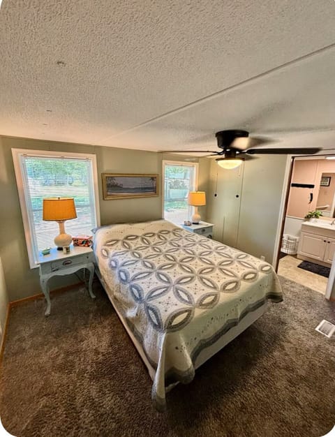 Master bedroom with queen bed, and master bath