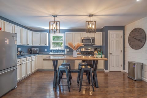 Fully stocked kitchen with kitchen bar