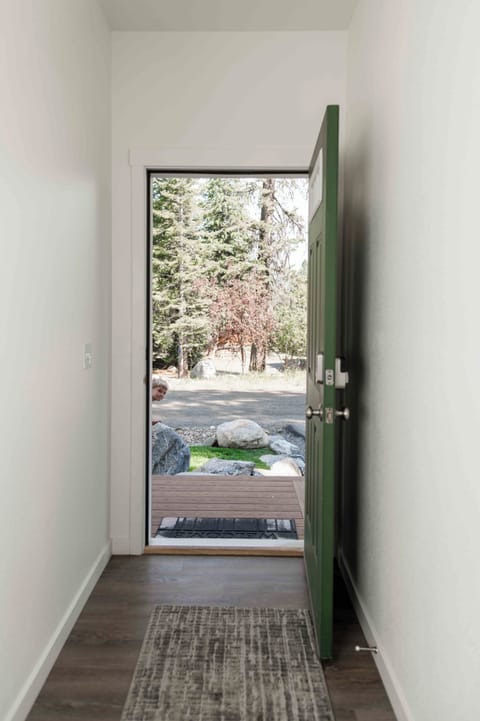 Front door with views of the forest surrounding the property