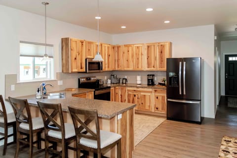 Fully equipped kitchen with modern appliances and cookware